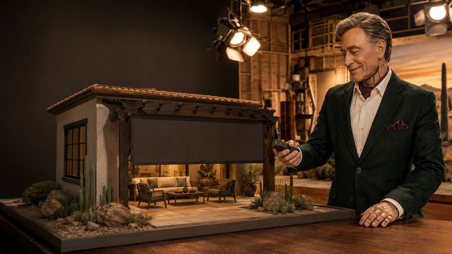 Animatronic studio host presenting a miniature Arizona patio with a descending exterior screen